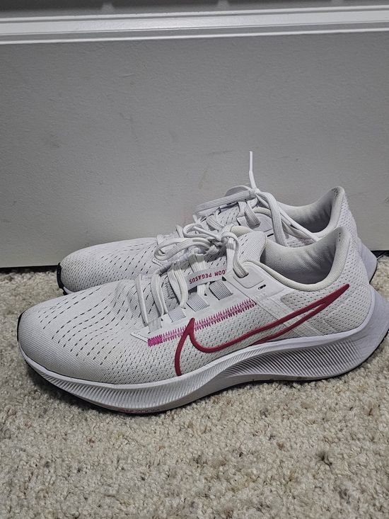 Nike Shoes - Nike White Athletic Running Shoes with Pink Swoosh